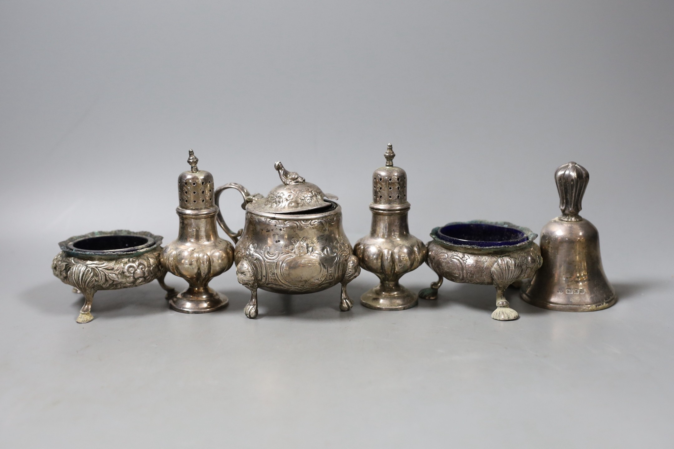 A modern silver hand bell and five assorted silver condiments including three 19th century.